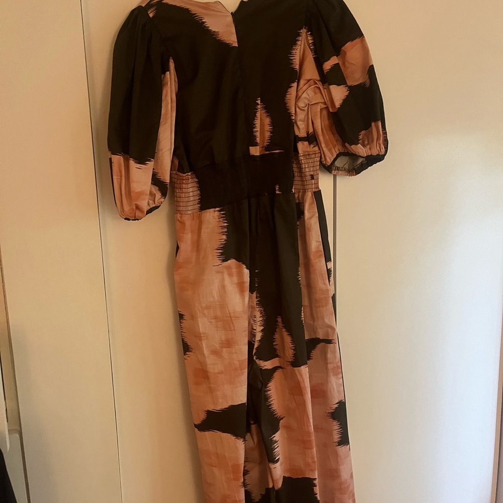 Light pink brown jumpsuit.  New without tags.  Mid calf length.
